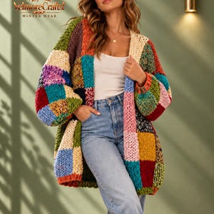 May include: A chunky knit cardigan featuring a multi-colored patchwork design with large squares in shades of red, blue, green, yellow, pink, and cream. The garment has long sleeves and an open front. The text VelmoreCrafts! WINTER WEAR is visible.