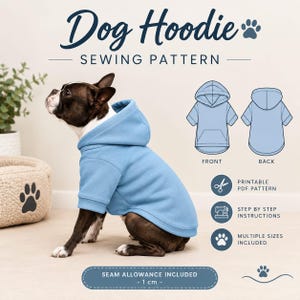 May include: A sewing pattern for a dog hoodie featuring the text Dog Hoodie Sewing Pattern. The image shows a French Bulldog wearing a light blue hoodie, technical line drawings of the front and back, and text stating Seam Allowance Included - 1 cm.