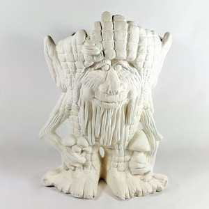 May include: A ceramic garden gnome statue in an off-white color. The gnome has a long beard, a smiling face, and is holding mushrooms. The gnome's hat and body have a textured, woven pattern.