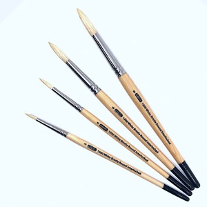 May include: Four paint brushes with wooden handles and black ferrules. The brushes are labelled "1300 White Bristle Round Interlocked" and are sizes 2, 4, 6, and 8.