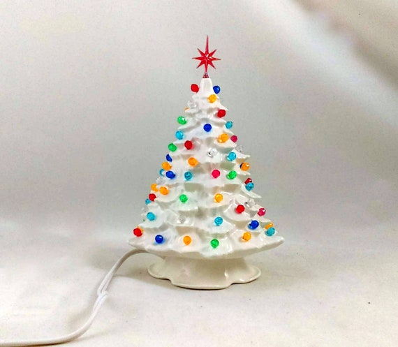 small white christmas tree with lights