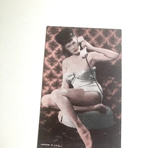 vintage pinup female photo ephemera card with woman talking on the phone in lingerie with high hairdo