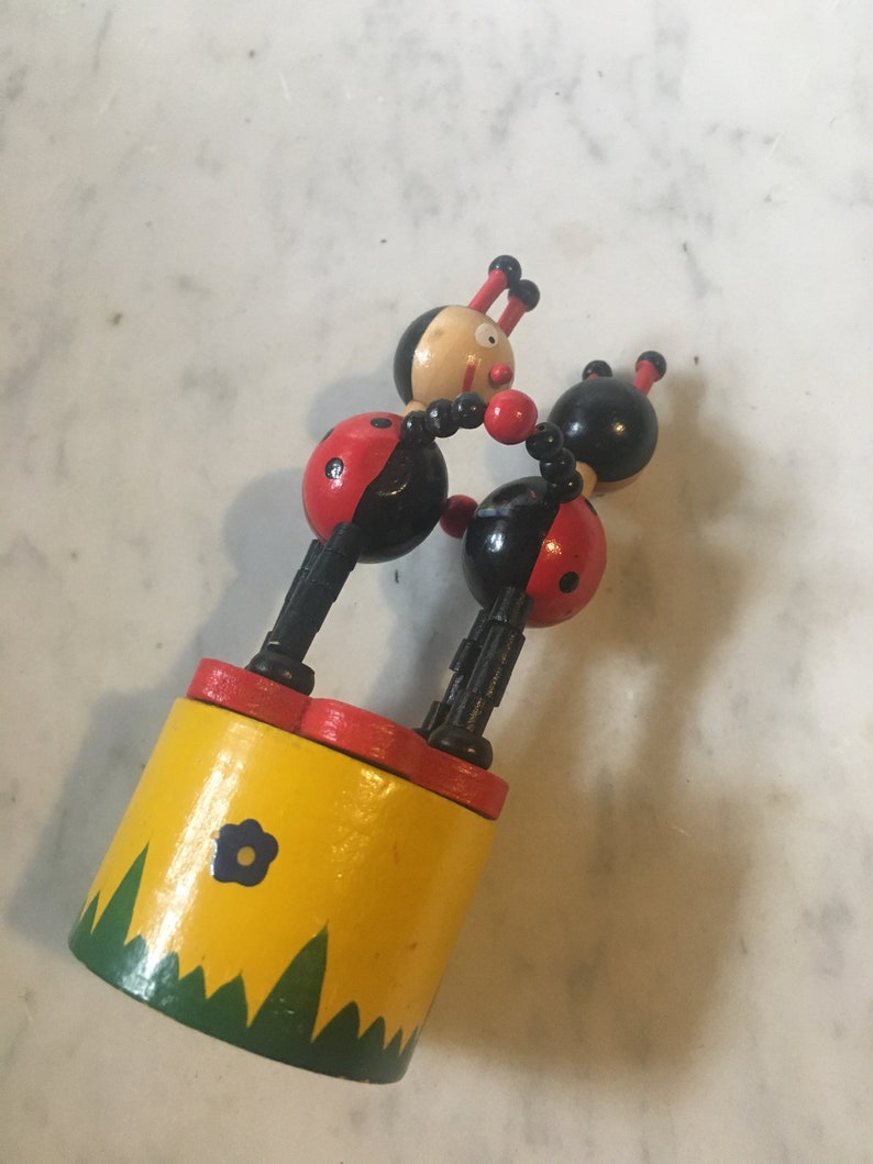 Two wooden lady bugs collapsible toy Etsy
