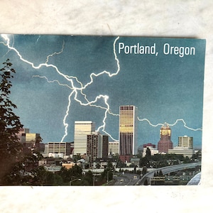 vintage postcard of portland skyline with lightning