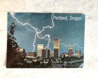 vintage postcard of portland skyline with lightning