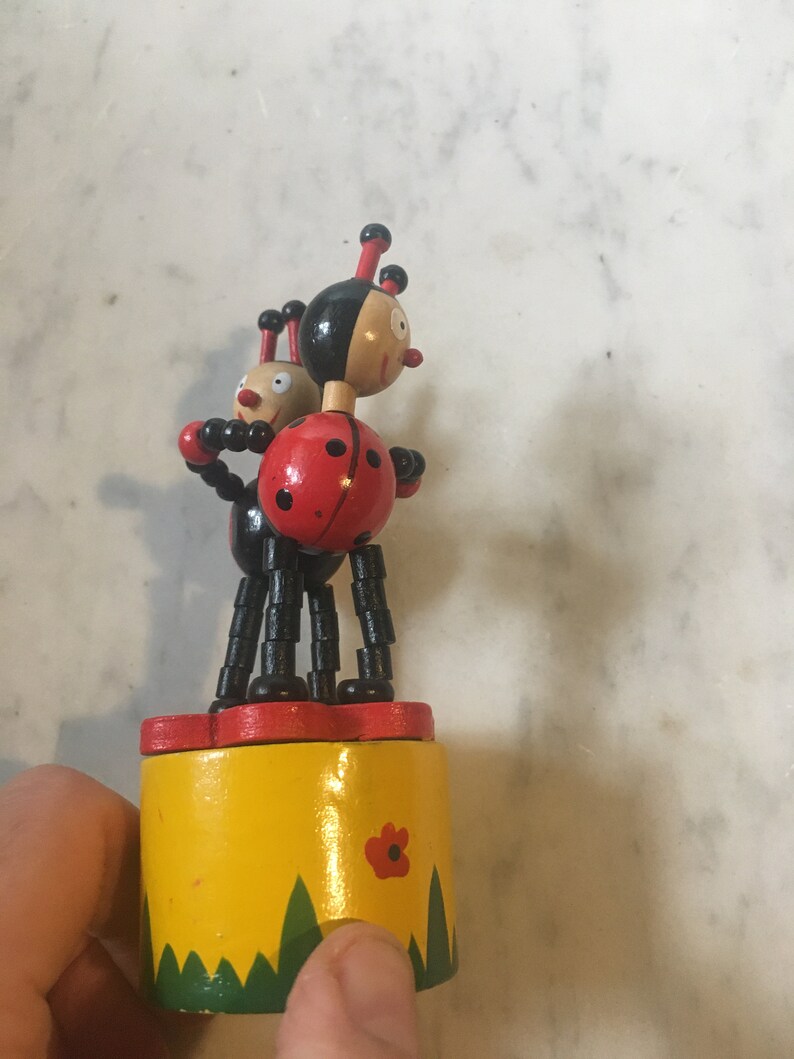 Two wooden lady bugs collapsible toy Etsy