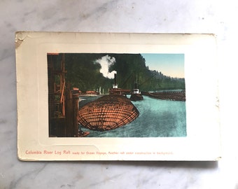 vintage postcard of log raft on columbia river gorge