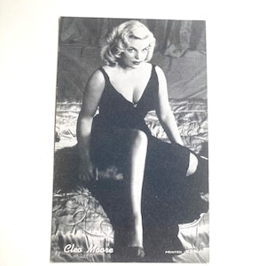 vintage pinup female photo ephemera card with woman leaning over in lingerie