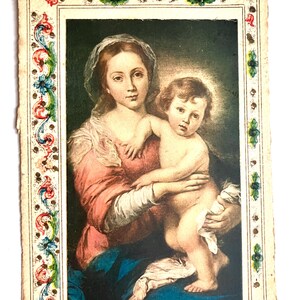 vintage postcard of madonna and child with floral border no makers marking