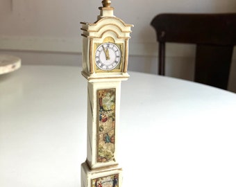 tiny white plastic petite princess dollhouse sized grandfather clock with pastoral painting adornment by ideal made in japan