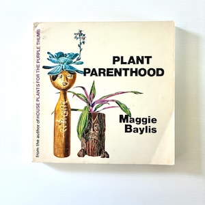 May include: A vintage book cover for "Plant Parenthood" by Maggie Baylis. The cover features illustrations of wooden plant holders with plants, and the text "from the author of HOUSE PLANTS FOR THE PURPLE THUMB".