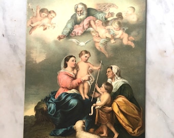 vintage souvenir postcard of madonna and child with lamb handing cross to another child