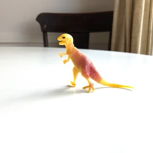 vintage tiny plastic tyrannosaurus rex dinosaur