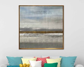 May include: A white sofa with colorful pillows in a living room setting. The sofa is in front of a white wall with a framed abstract painting above it. There is a black and white striped rug on the floor.