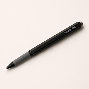May include: A black hexagonal pen with a grey ribbed grip section and a grey click-top button. The barrel of the pen features the white text "Forever Pen" printed clearly along the side. The pen has a sleek, modern design with a pointed tip.