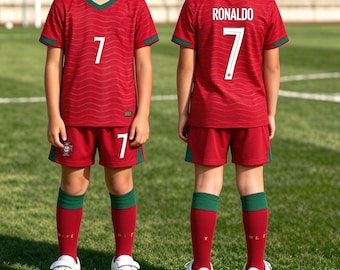 May include: A red soccer uniform featuring a V-neck jersey with a wavy pattern, the number 7, and matching shorts. The back of the jersey displays the name RONALDO and the number 7 in white. The set includes red socks with green cuffs and white sneakers.