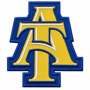 May include: An embroidered patch featuring the letters A and T in a stylised, overlapping design. The letters are yellow with a white outline, set against a bold blue background with a thick blue border following the shape of the letters.