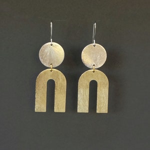 Modern geometric brushed metal U shaped dangle earrings | two tone gold and silver horseshoe shaped statement earrings