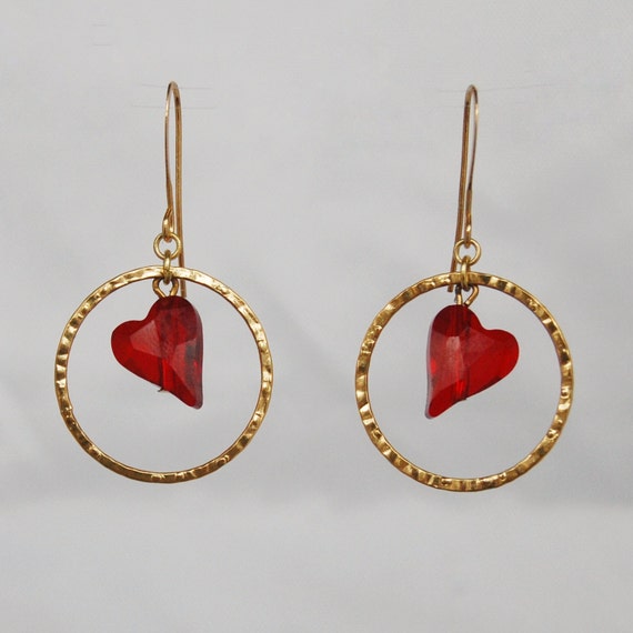 Red heart earrings with Swarovski asymmetric wild heart crystal in a gold hoop