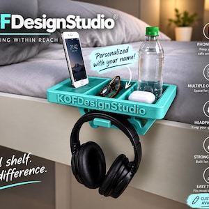 May include: A teal bedside caddy labeled KOFDesignStudio with multiple compartments holding a smartphone, eyeglasses, a water bottle, and white earbuds. A black headset hangs from a hook on the front. The text reads KOFDesignStudio, Everything Within Reach, Personalized with your name, and Small shelf. Big difference.