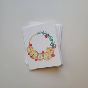 Feestelijke sinaasappelenkrans - winter/vakantiekaart