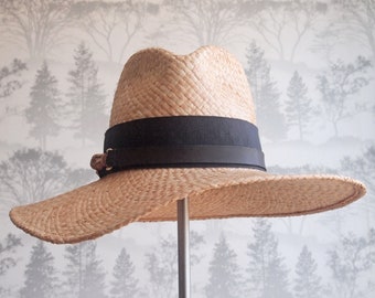 Jordan:  Fedora straw hat and east to west sweeping wide brim with double dark chocolate trim with bamboo finding