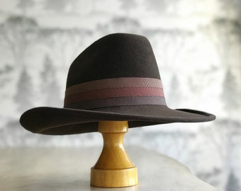 Western style felt brown cowboy hat with tri-colored ribbon trim in brown hues