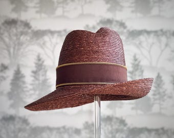 Fashionable brown straw hat with side upturn brim and asymmetrical center crease crown size small