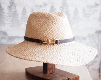 June:  Doubled natural raffia trilby crown with floppy brim and bamboo finding with chocolate leather trim