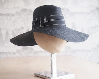 Black straw braid wide brim floppy sun hat with black and white grosgrain trim