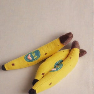 Life size banana rattle soft toy decorated with heart embroidery stitching, eco friendly handmade baby toy , Made in Denmark