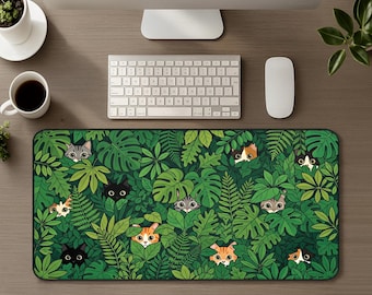 May include: A rectangular desk mat featuring a dense, vibrant green jungle pattern filled with various tropical leaves and ferns. Multiple cartoon cats of different colors and markings, including black, orange, and tabby, peek out from the foliage.