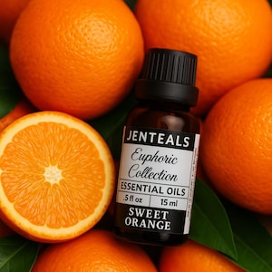May include: A close-up shot features a bottle of JENTEALS Euphoric Collection Sweet Orange essential oil, .5 fl oz, 15 ml, with a black cap. The bottle is surrounded by whole and sliced oranges, with green leaves. The oranges are bright orange.
