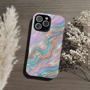 May include: A smartphone case with a swirling, iridescent design in shades of pink, blue, and gold. The case has a glossy finish and a camera cutout. The overall theme is abstract and artistic.