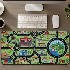 May include: A green and black road map design mousepad with a town scene. The mousepad features roads, buildings, trees, and a lighthouse scene. The buildings include a fire station, police station, and shops.