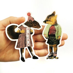 May include: Two whimsical stickers featuring anthropomorphic animals. One sticker depicts a squirrel in a dress and party hat. The other shows a fox in a jacket and shorts on roller skates. The stickers have a vintage, collage-like aesthetic.