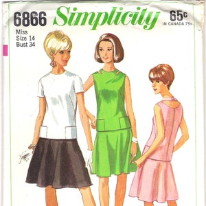 May include: A vintage sewing pattern for a dress with three different styles. The pattern is for a size 14 bust and is from Simplicity pattern number 6866.