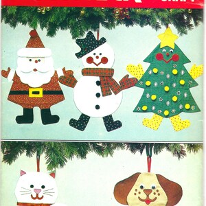 May include: A vintage craft pattern from Butterick, pattern number 6054, for making five Christmas ornaments: a snowman, a Christmas tree, Santa Claus, a cat, and a dog.