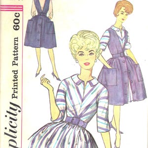 May include: Vintage Simplicity sewing pattern 4092. The pattern features illustrations of dresses with button-down fronts, pockets, and belted waists. The dresses are shown in blue and white striped and solid fabrics. The pattern includes sizing information.