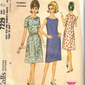 May include: A vintage McCall's sewing pattern envelope, number 7229, for a dress in size 40 bust 42. The illustration shows three variations of a dress: one with a blue and white floral print, one solid blue with pockets, and one with a pink floral print.