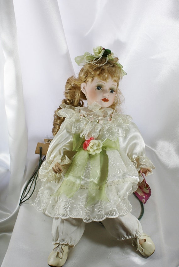 porcelain doll on swing