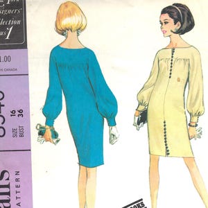 May include: Vintage sewing pattern featuring two women in dresses. One woman is in a teal dress with long sleeves, and the other is in a light yellow dress with buttons down the front. The pattern is labeled "8540" and includes sizing information.