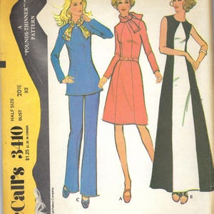 May include: Vintage McCall's 3410 sewing pattern featuring three half-size dress or tunic and pants designs. The cover shows illustrations of the garments in blue, coral, and black and white. The pattern includes bust sizes 20 1/2 and 43.
