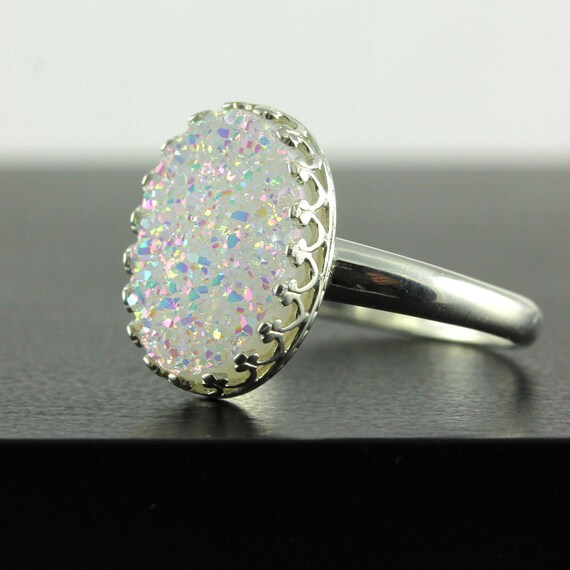 Sterling silver ring with tiny Druzy quartz in silver bezel and brass prongs setting