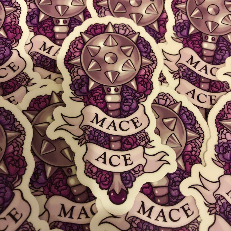 May include: A sticker featuring a purple and gray mace with a floral design. The mace has a spiked ball and a handle with a purple gem. The text "Mace Ace" is written on a banner around the mace.
