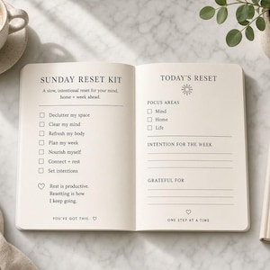 May include: An open planner with cream-colored pages featuring the text Sunday Reset Kit and Today's Reset. The left page lists tasks like declutter my space and plan my week. The right page includes sections for focus areas, intention for the week, and grateful for.
