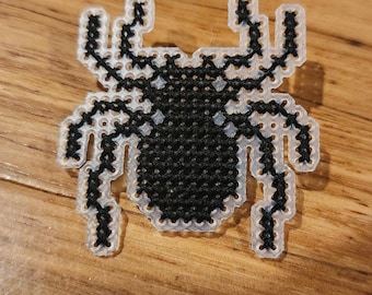 Pin de punto de cruz de araña