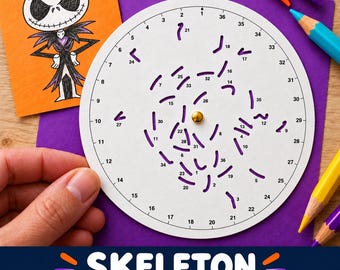 May include: A white circular spin-and-draw game board featuring numbered slots from 1 to 36, a central gold-colored metal fastener, and purple cut-out shapes. An orange square card displays a hand-drawn character with a skull-like face.