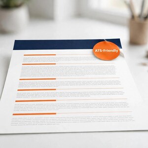 May include: A white resume template featuring a dark blue header and horizontal orange section dividers. An orange circular badge with the white text ATS-Friendly is attached to the top right corner of the document page.