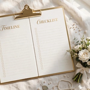 May include: A gold-toned clipboard holding a white paper sheet divided into two columns labeled Timeline and Checklist, each with lined spaces and checkboxes. A bouquet of white roses and greenery with a ribbon sits beside the clipboard.